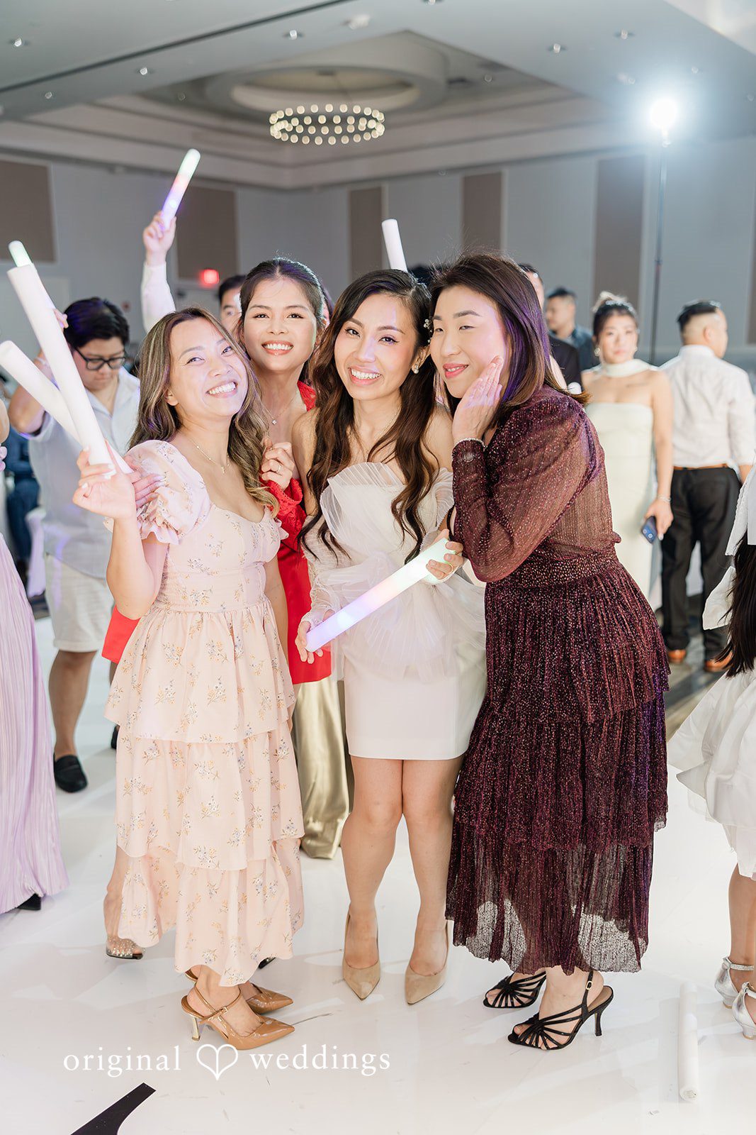 Khanh + Trung Bride celebrating with friends on the dance floor at the reception