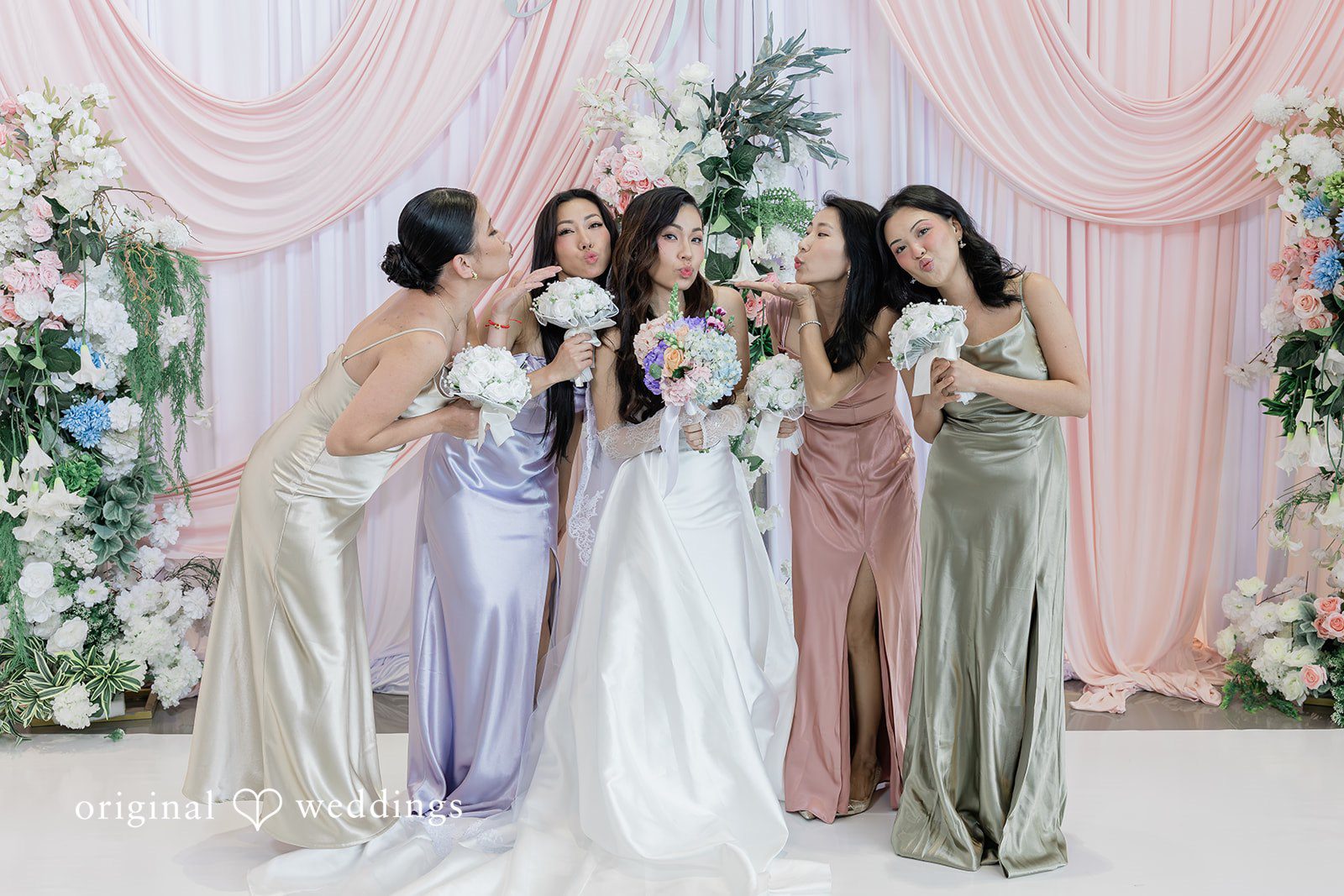 Khanh + Trung Bride posing with bridesmaids before the ceremony