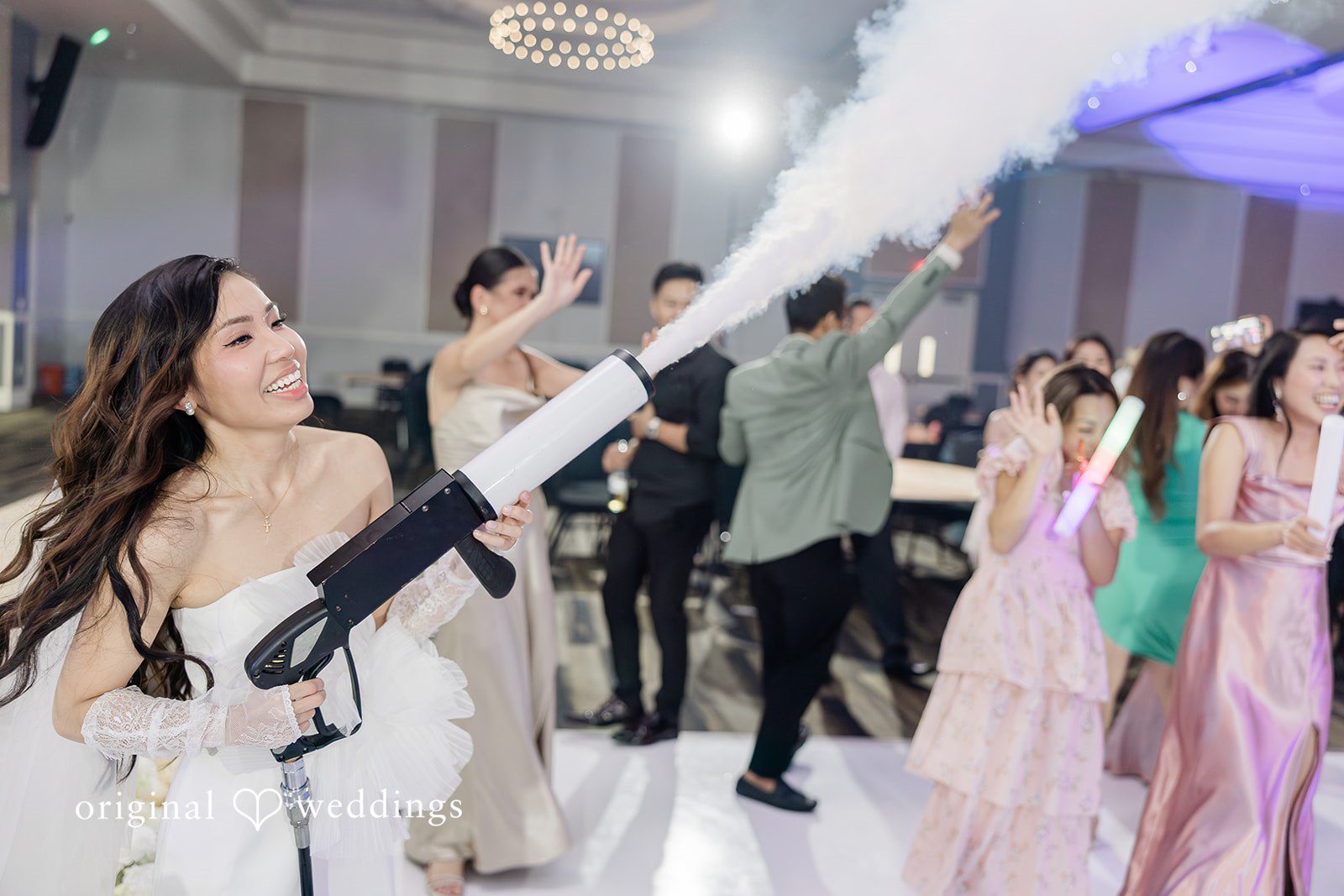 Khanh + Trung Bride and groom playing games together during the reception