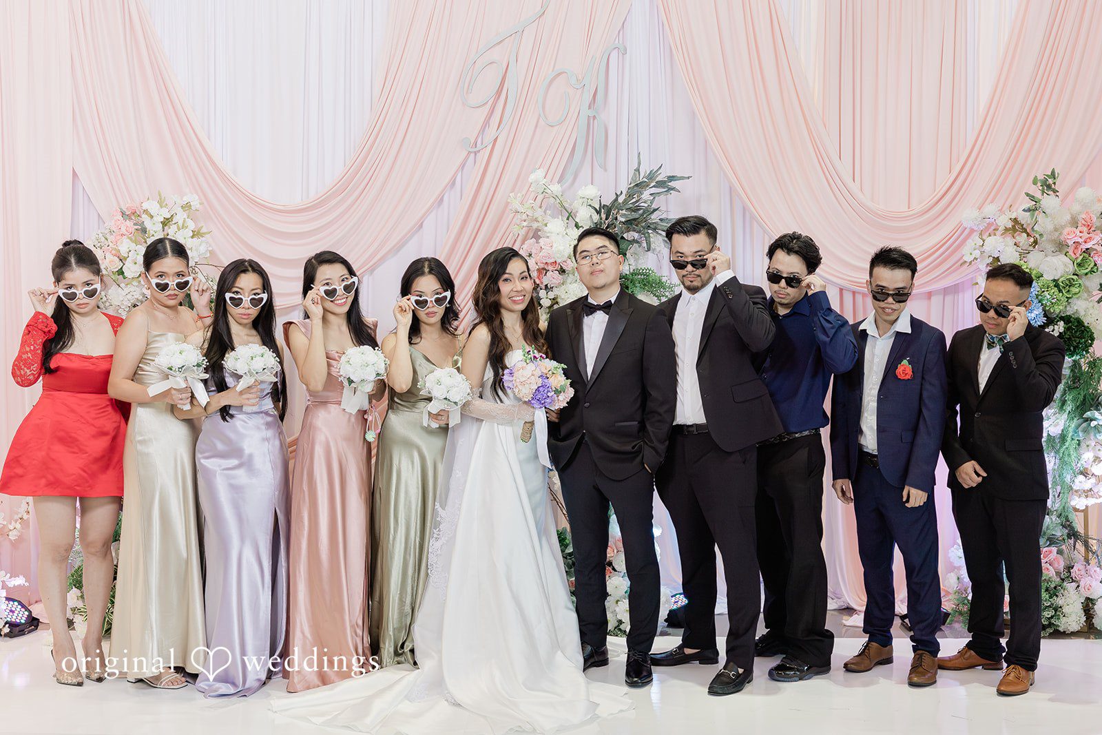 Khanh + Trung Bride and groom posing with bridesmaids and groomsmen together