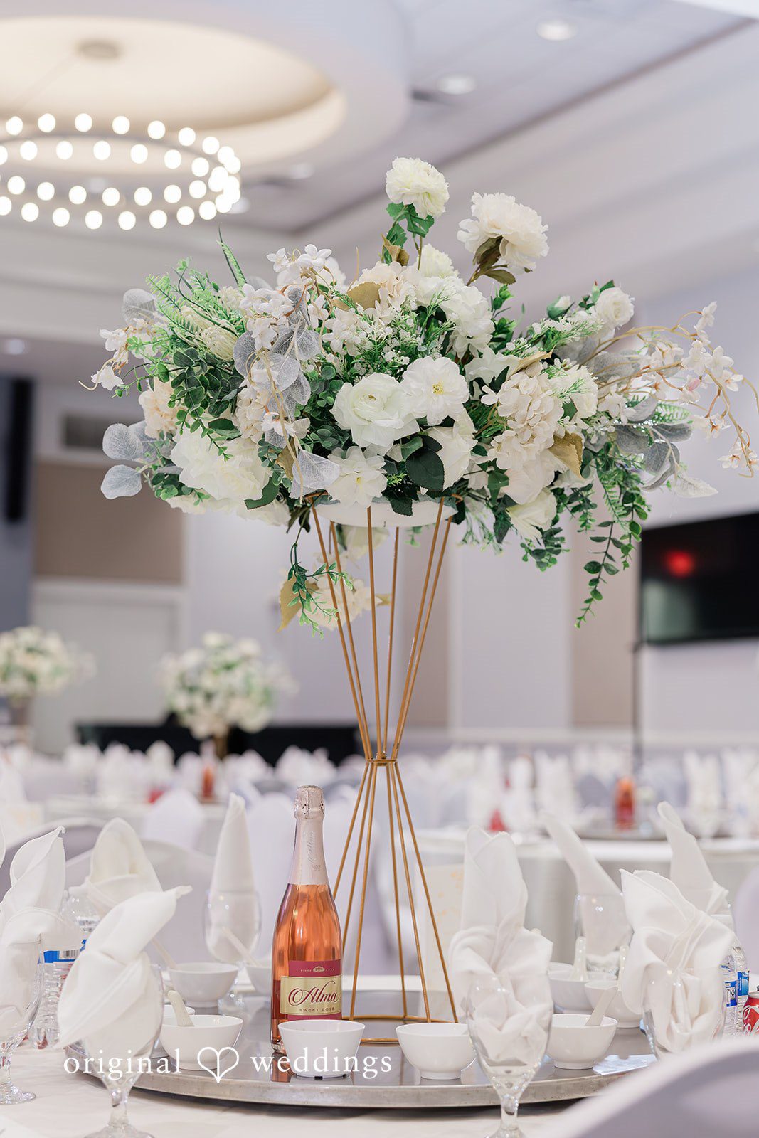 Khanh + Trung Close-up of decorated reception tables with elegant floral details