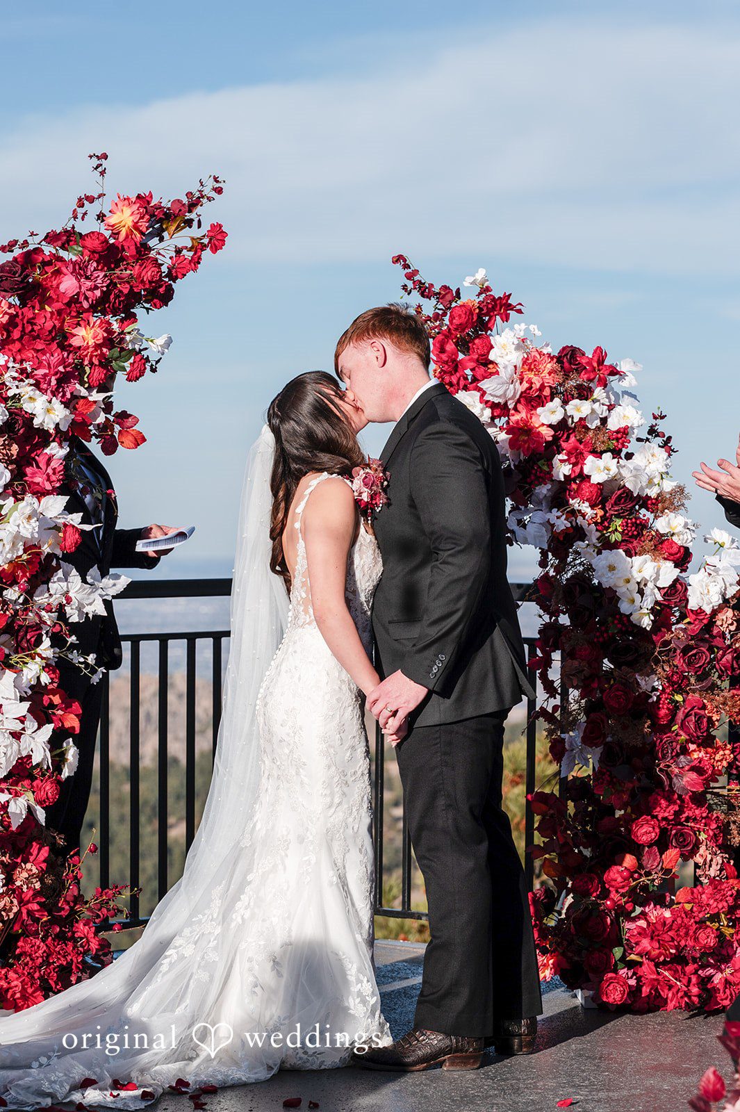 The couple seals their union with a kiss