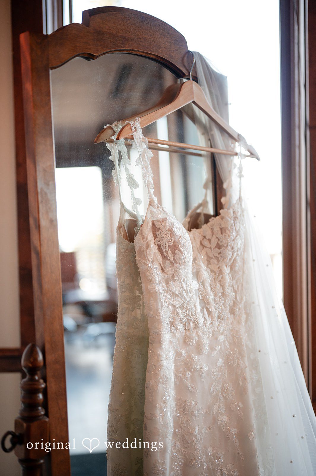 The bride's gown gracefully hanging at the suite