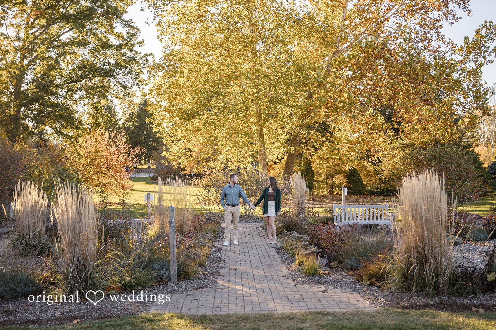 The couple takes a walk through the lush outdoor area