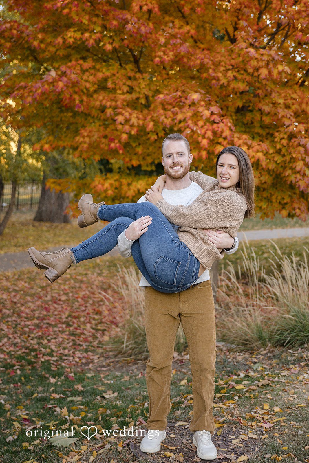 The groom carries his bride-to-be