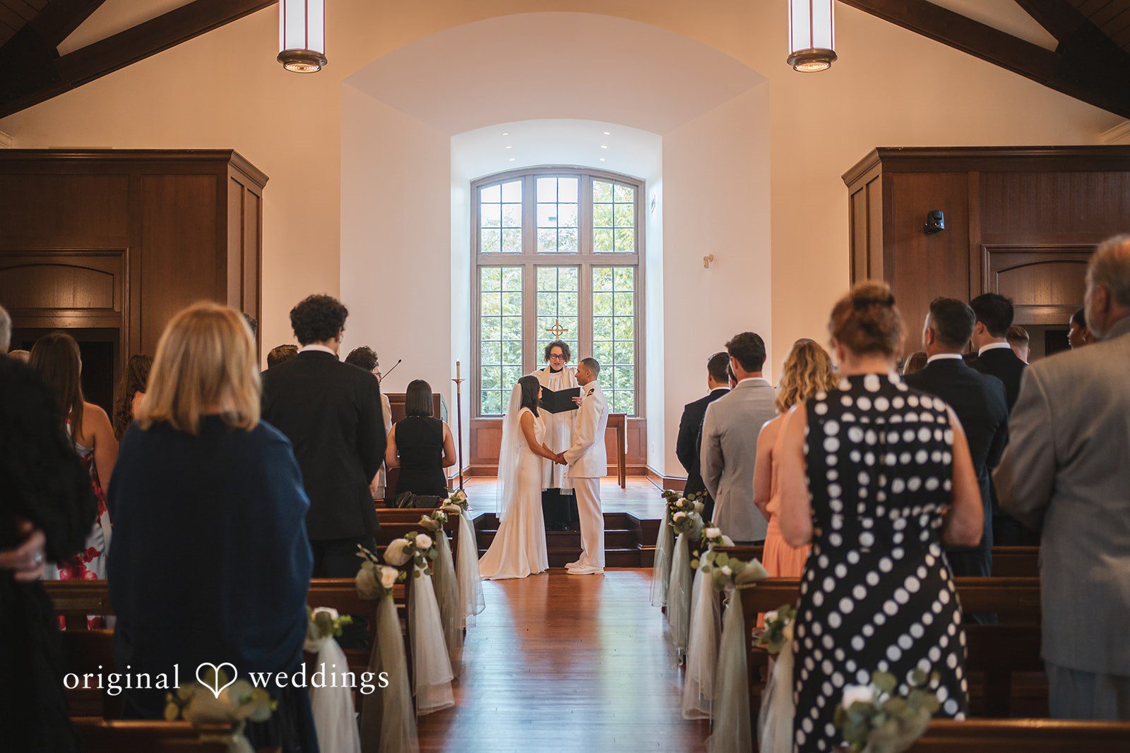 Peyton + Mia Wide-angle view of the couple exchanging vows during the ceremony