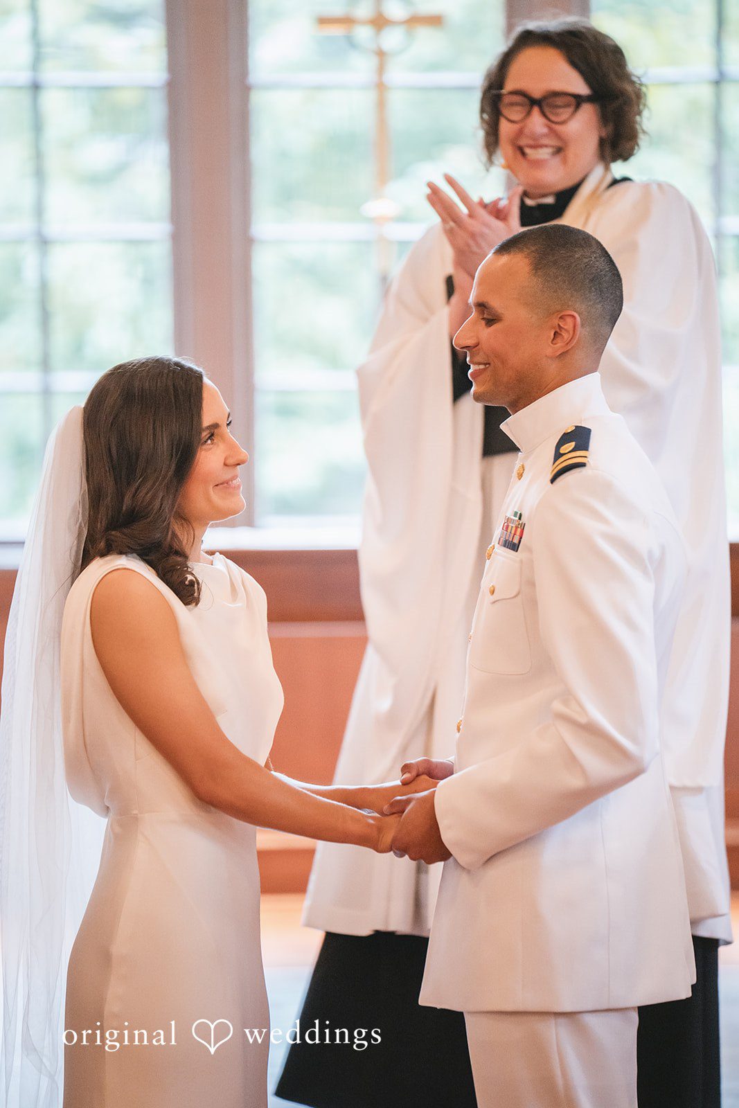 Peyton + Mia Newlyweds holding hands after exchanging vows