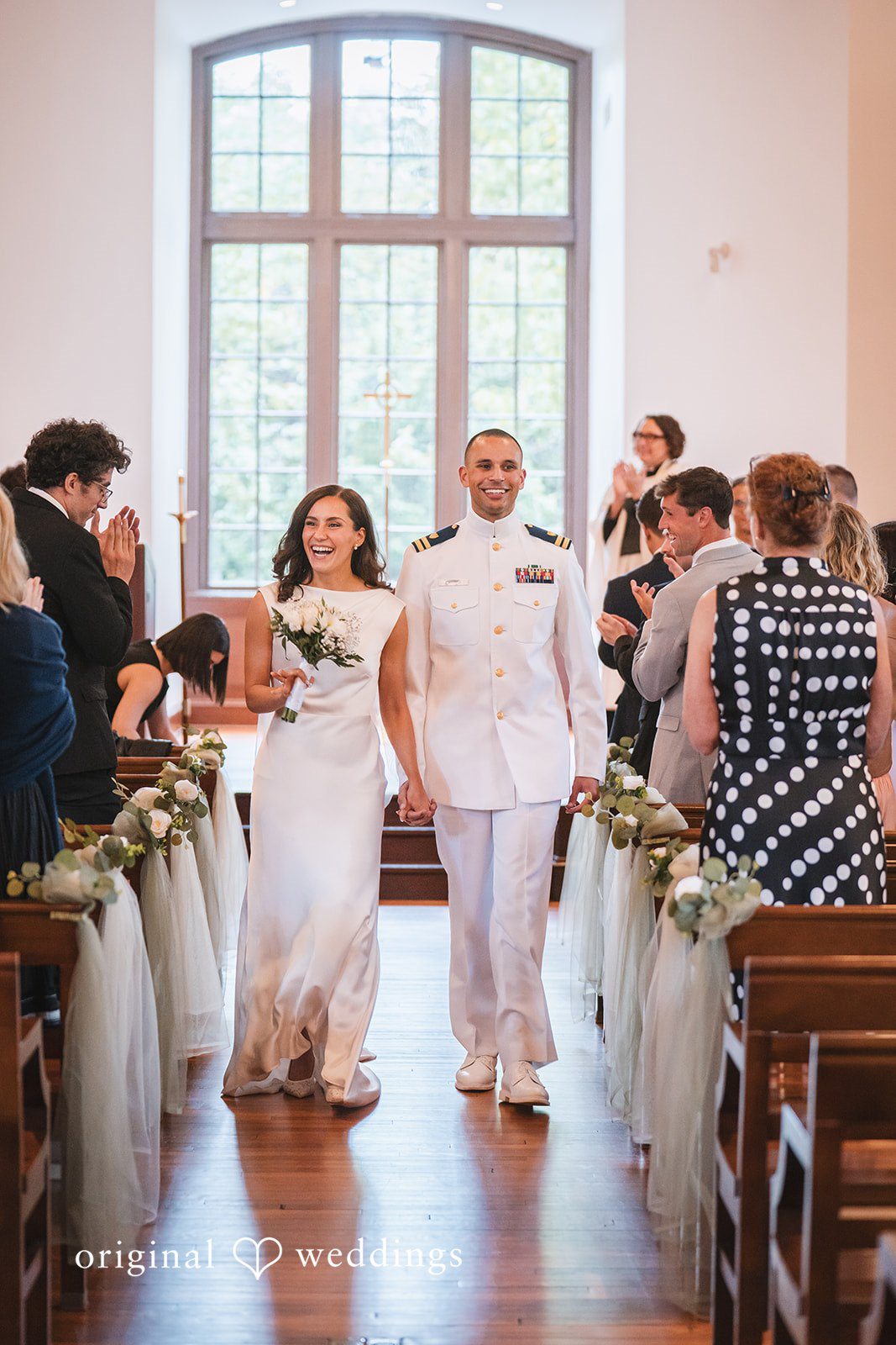 Peyton + Mia Bride and groom walking away from the ceremony together