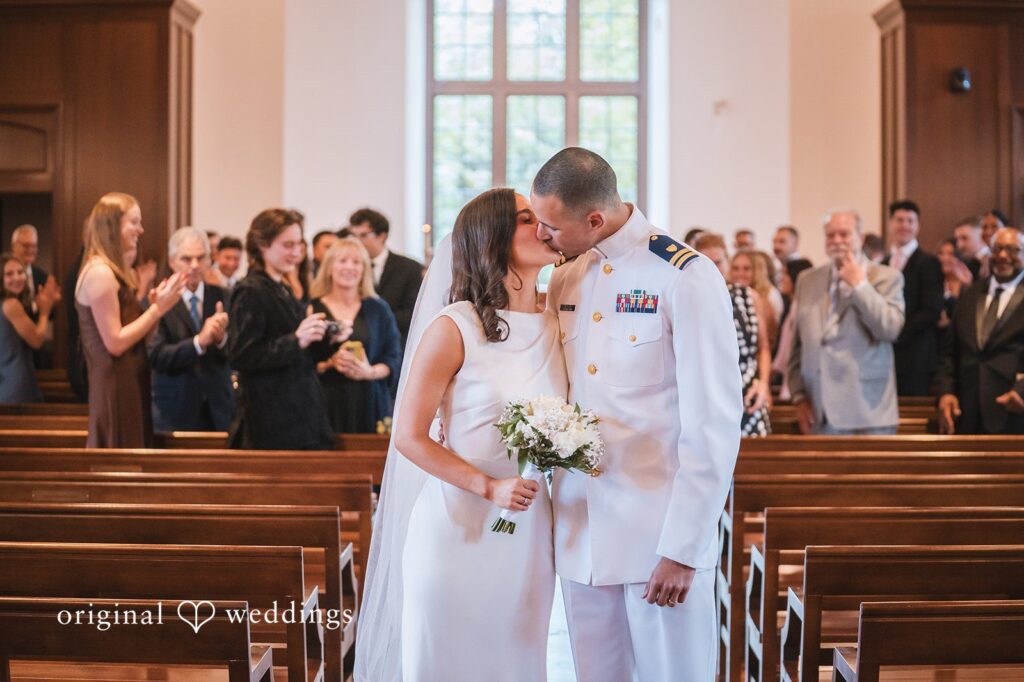 Peyton + Mia Couple sharing their first kiss after the ceremony