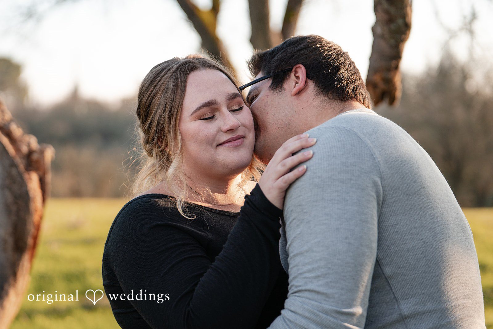 Ellie + Aaron The groom kisses the bride