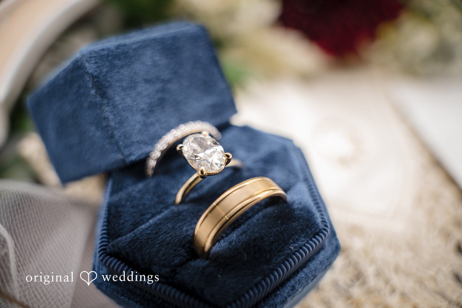 Close-up of the bride’s engagement ring and wedding band