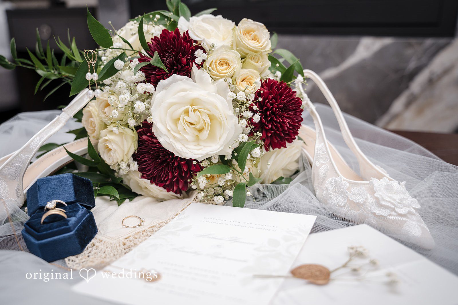 Wedding table flowers with handwritten letter detail