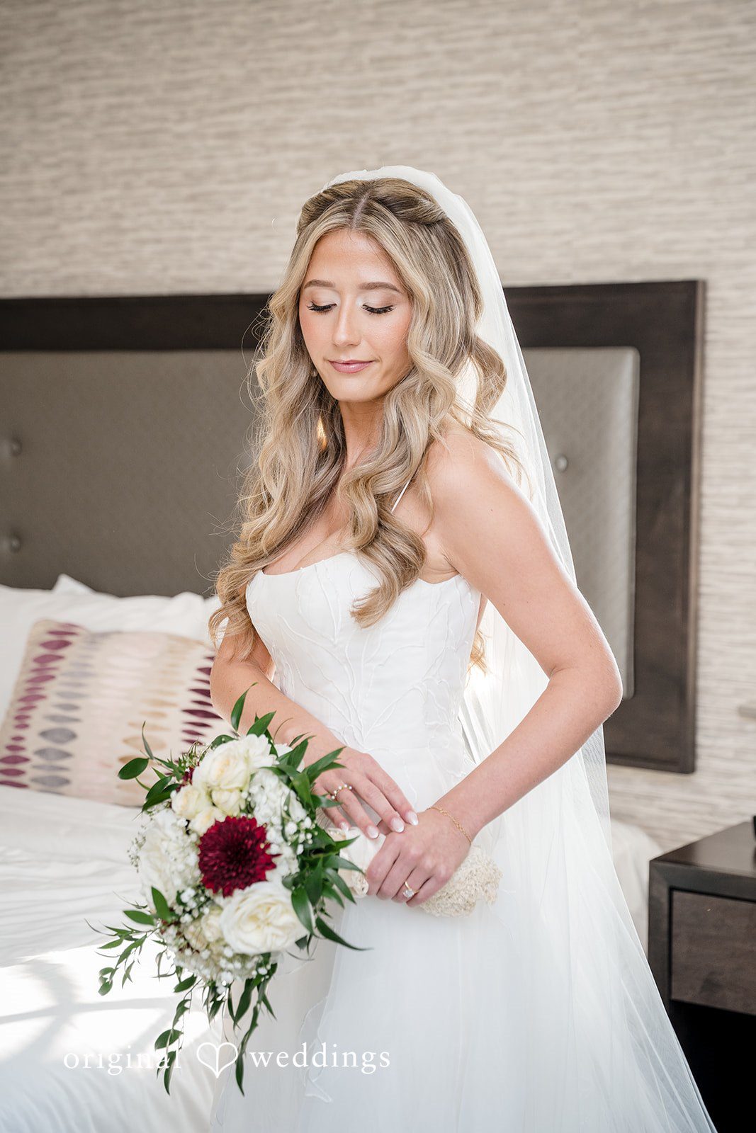Bride holding her bouquet after getting ready for the ceremony