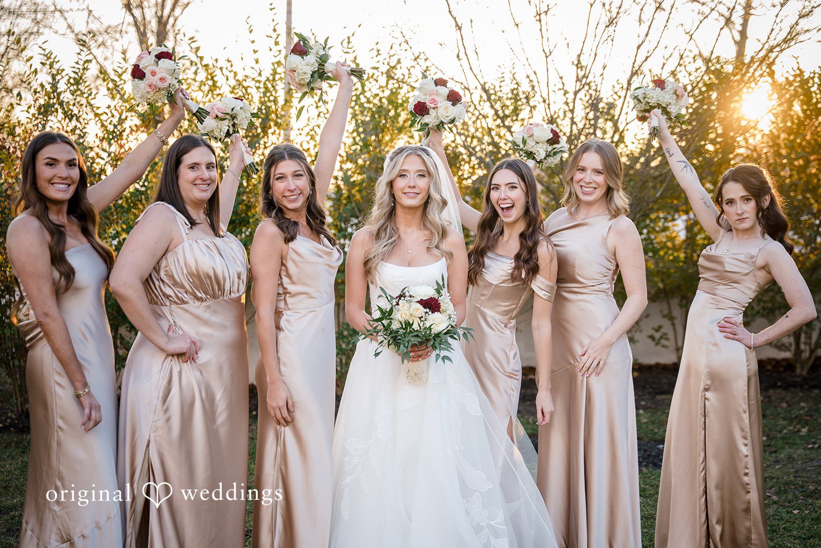 Bride and groom holding hands during wedding portraits