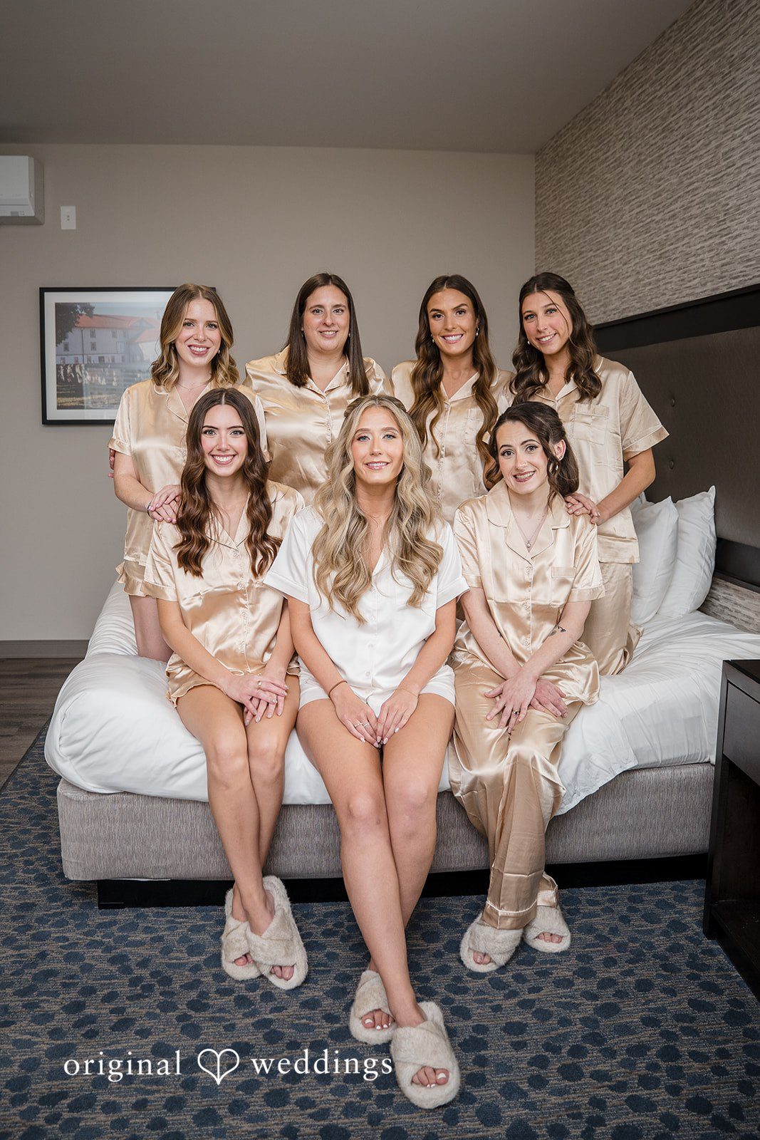 Bride getting ready with bridesmaids before the wedding