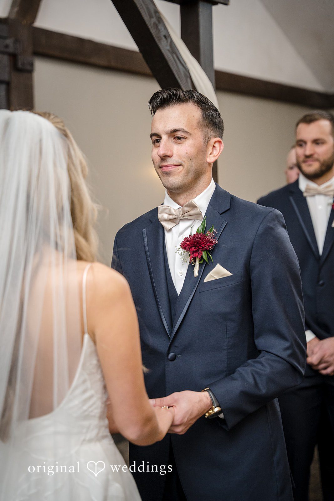 Groom looking emotionally at the bride during the vows