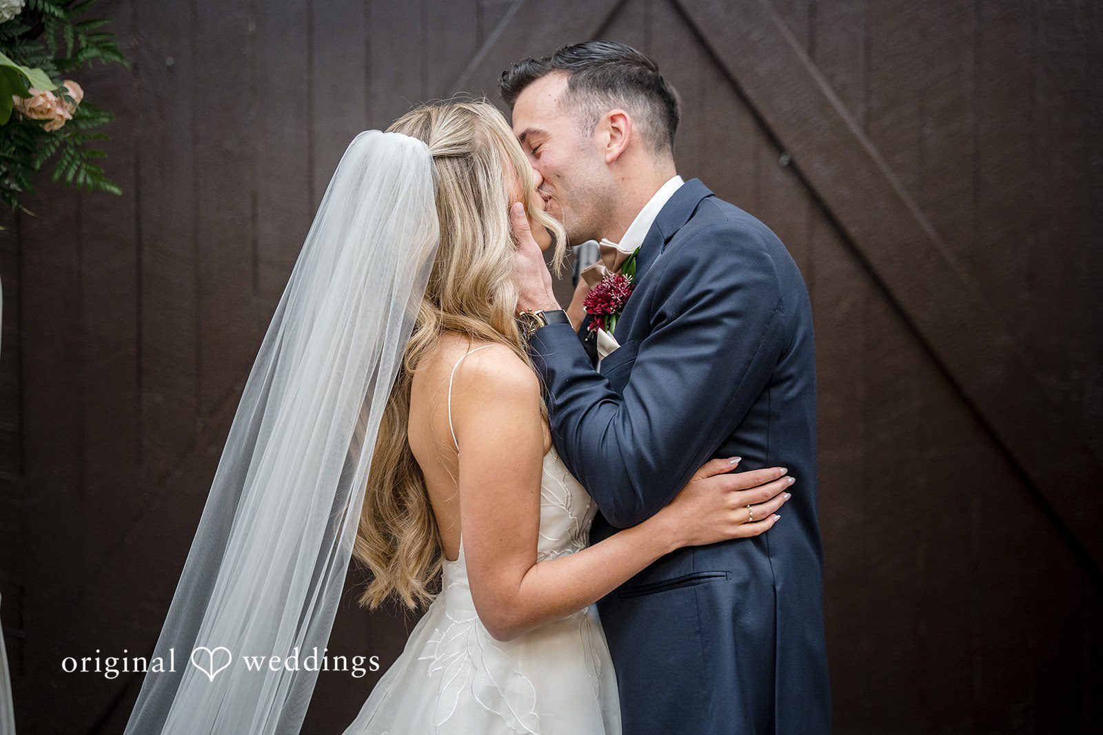 Couple sharing their first kiss during the ceremony