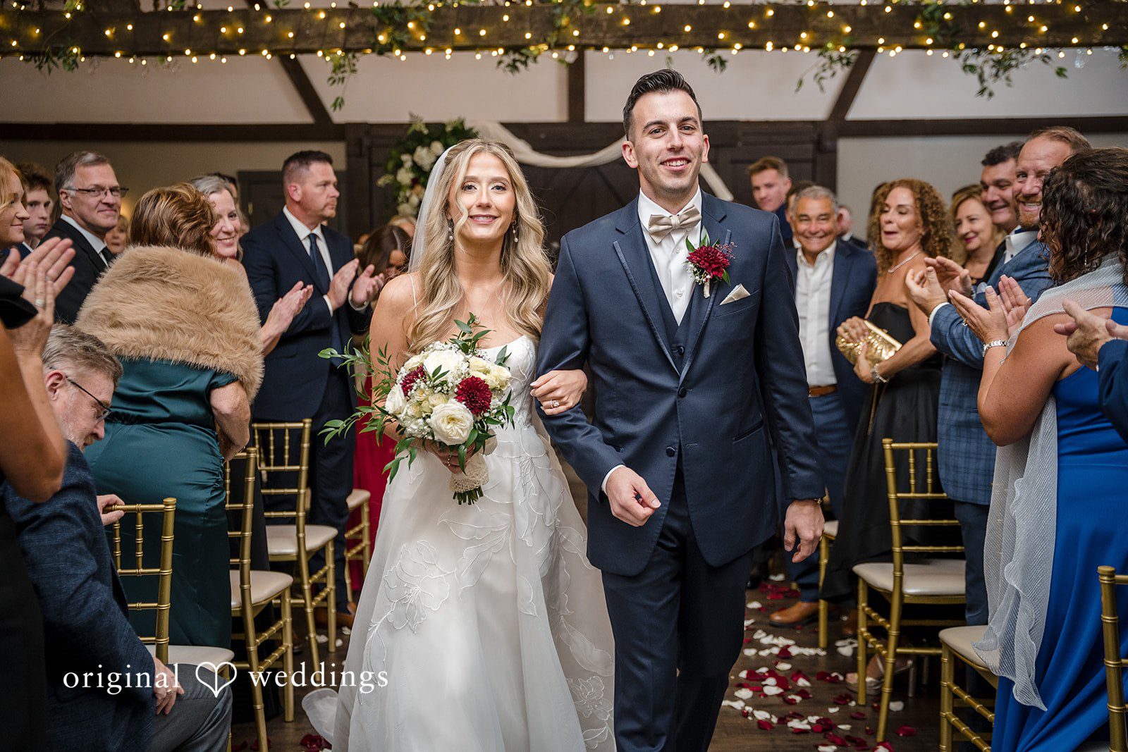 Newlyweds walking together toward the wedding reception