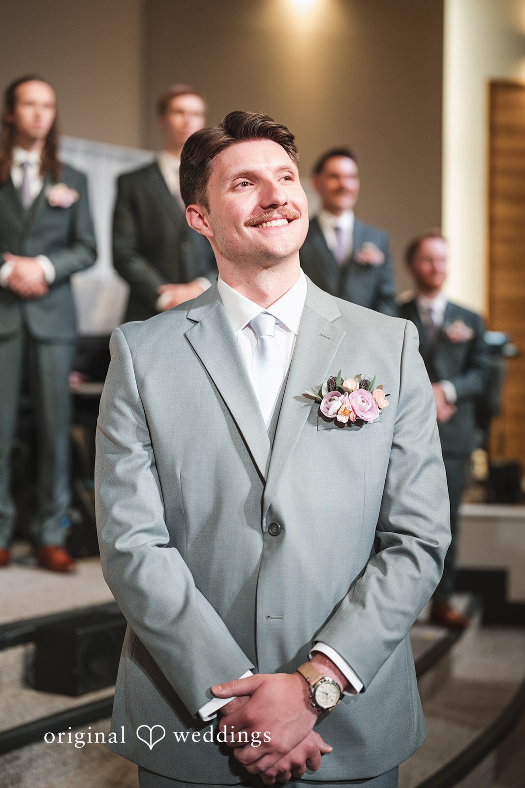 The groom anticipates the bride’s entrance