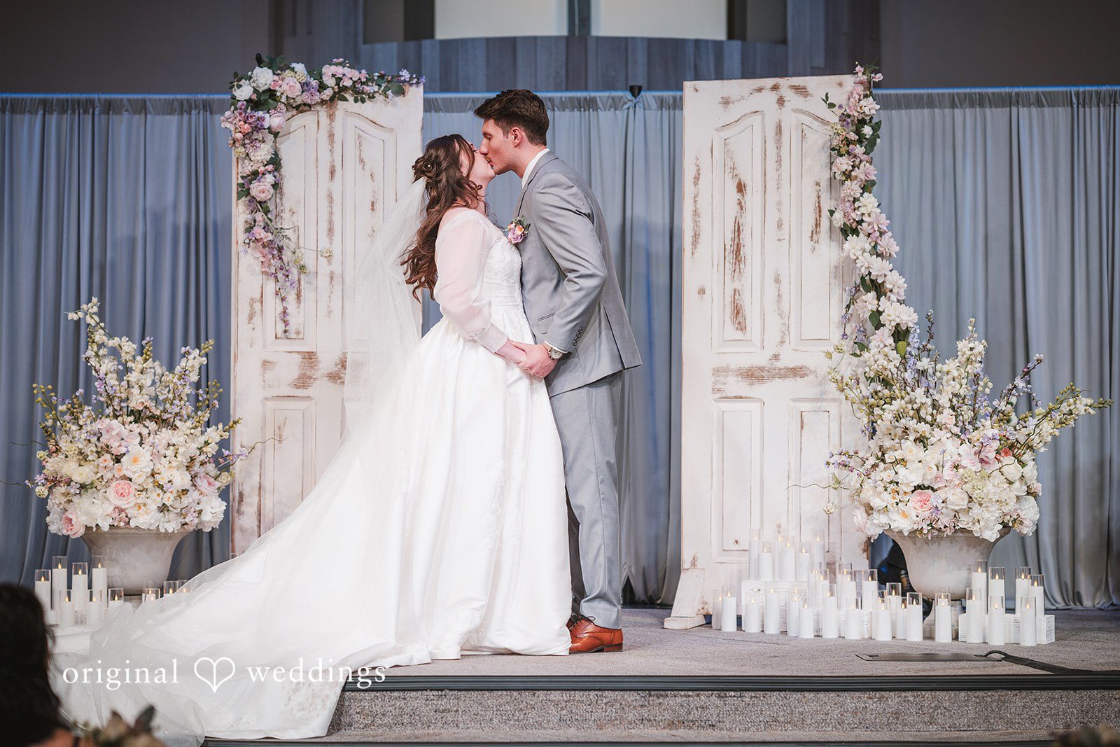 The couple seals their union with a kiss