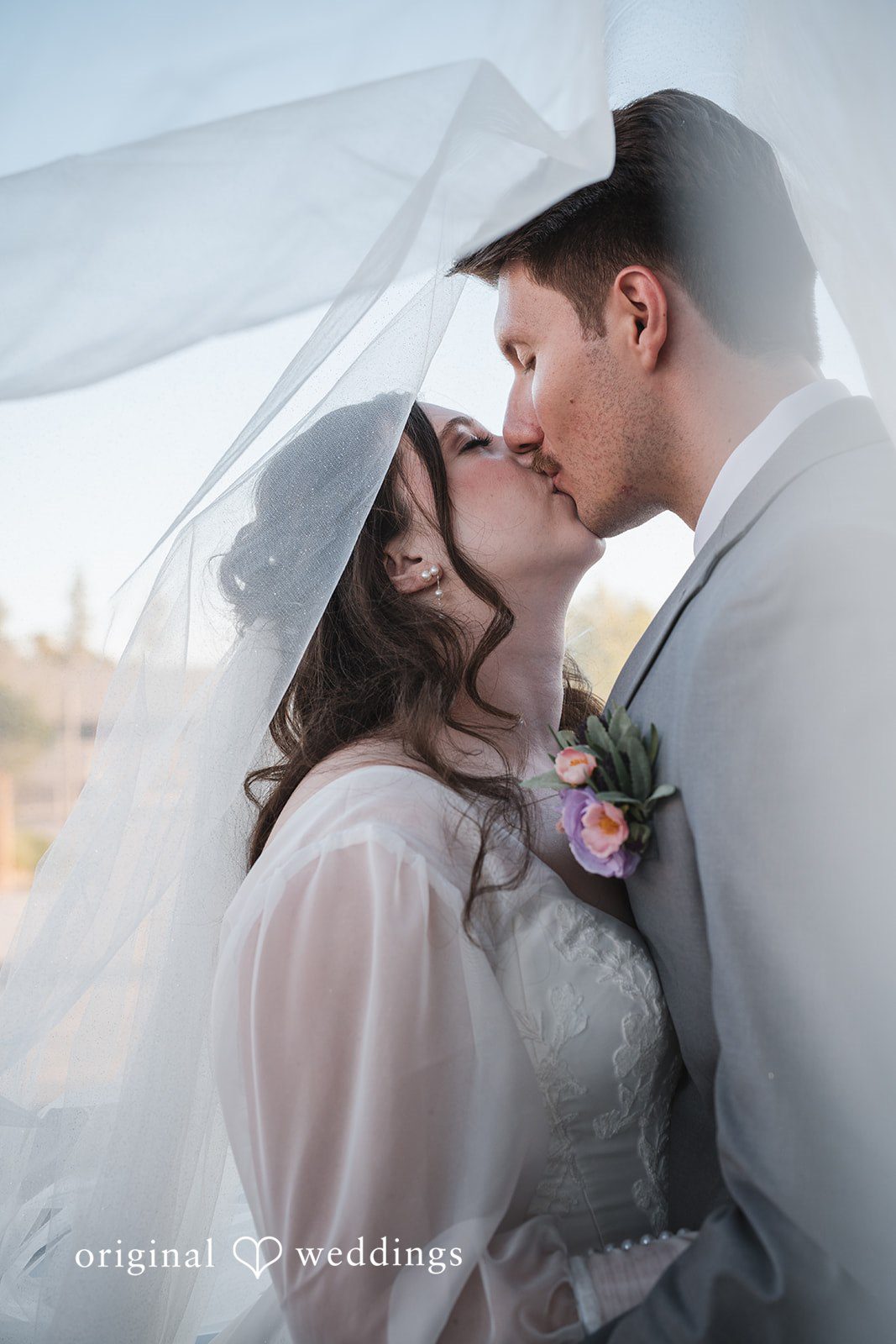 The couple shares a romantic kiss