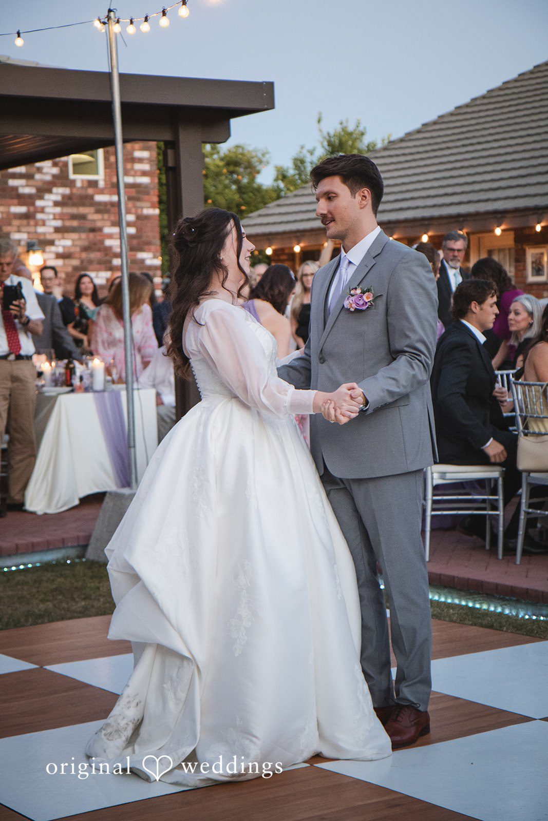 The couple takes their first dance