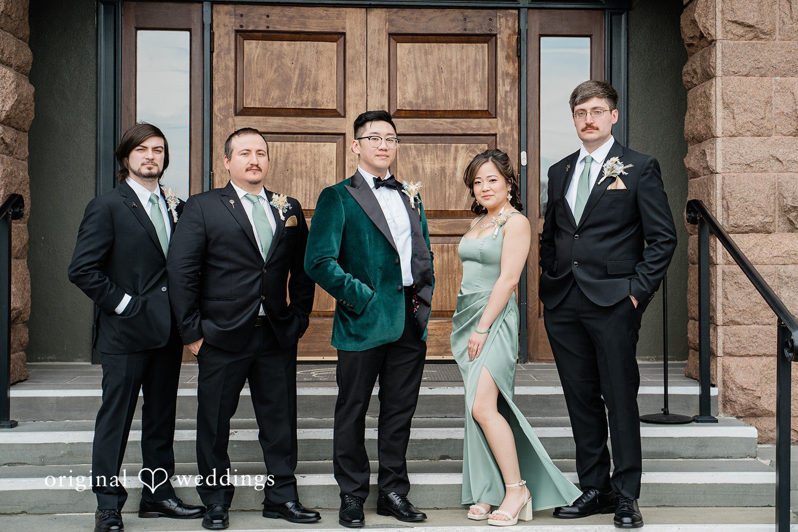 A portrait of the groom with the bridal party