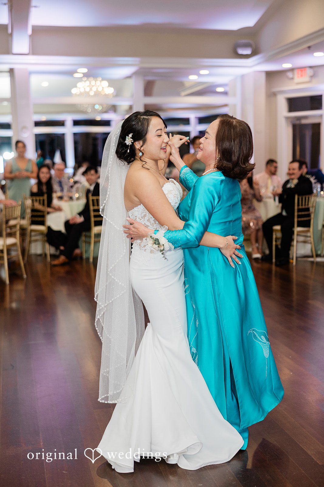 The bride dances with her mum
