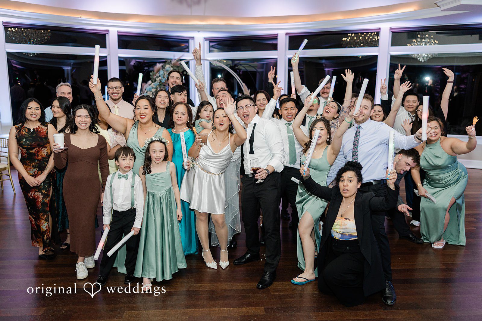 A beautiful night portrait of the couple and their wedding party