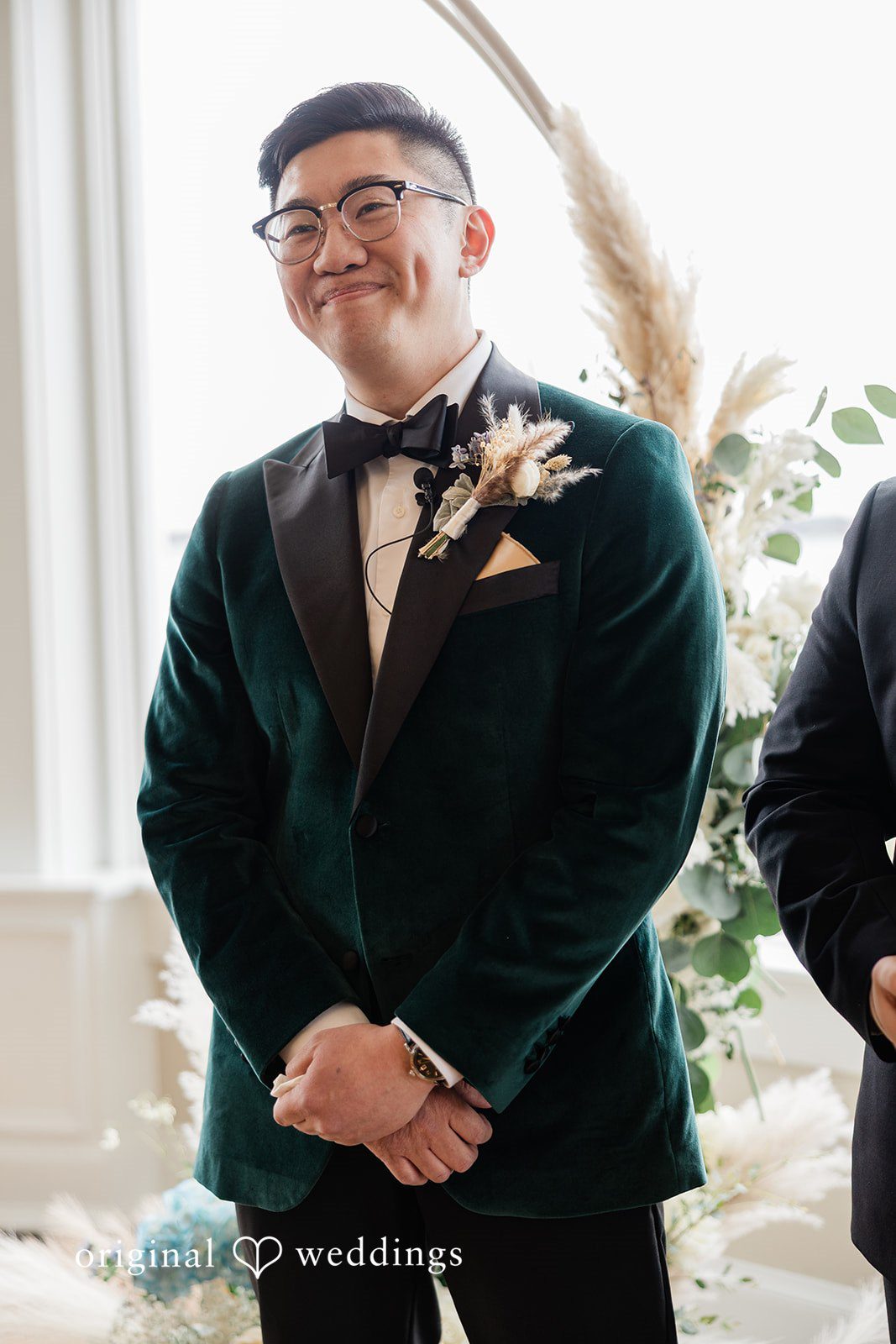 The groom joyfully anticipates the bride