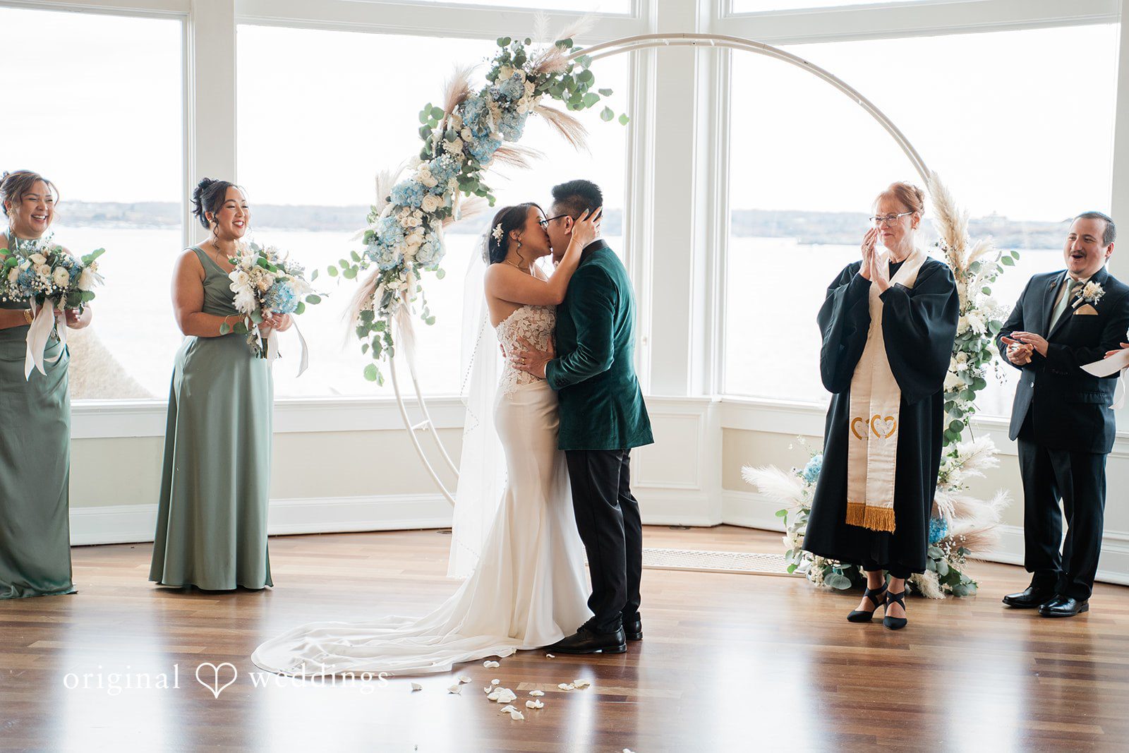The couple seals their union with a kiss