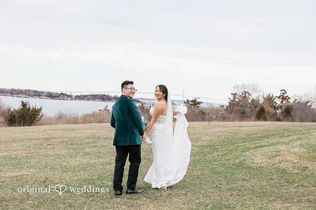 Our Providence wedding photographers at Original Weddings captured a stunning portrait of the couple by the field at OceanCliff