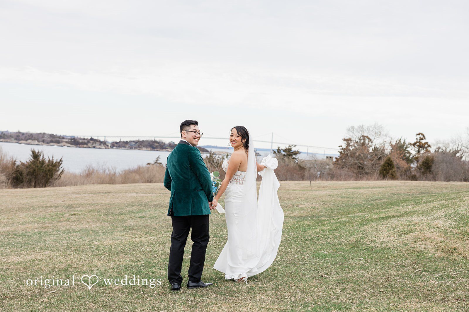 Our Providence wedding photographers at Original Weddings captured a stunning portrait of the couple by the field at OceanCliff