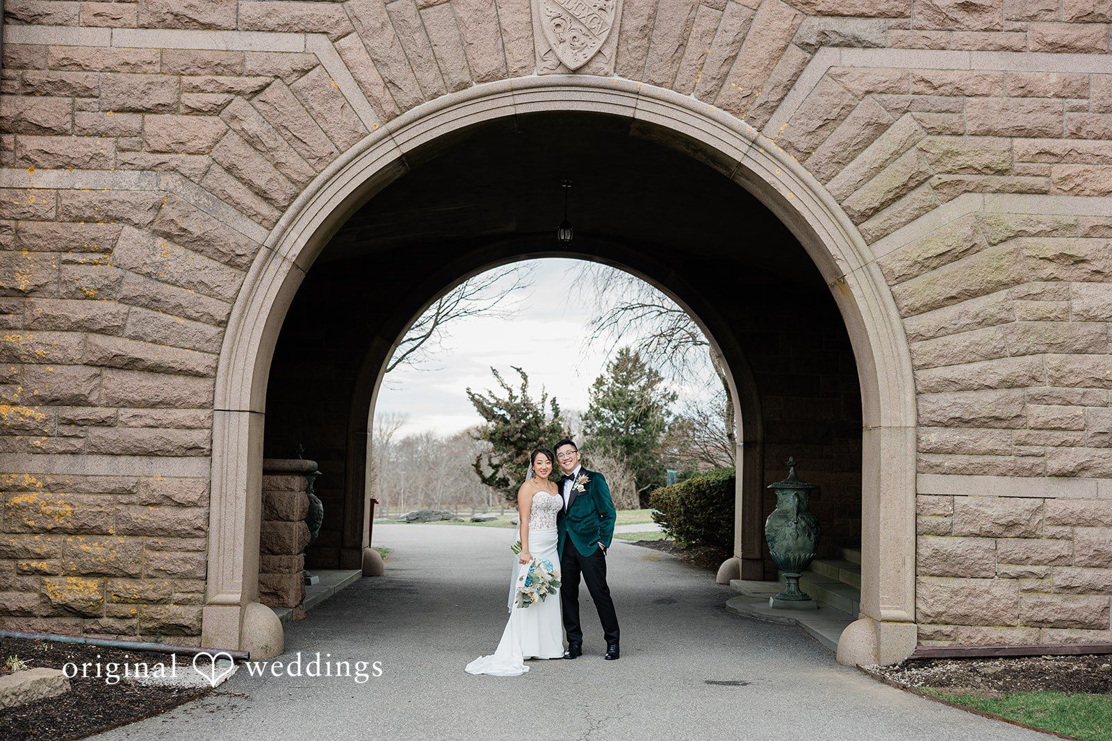 A stunning portrait of the couple by the stone patio