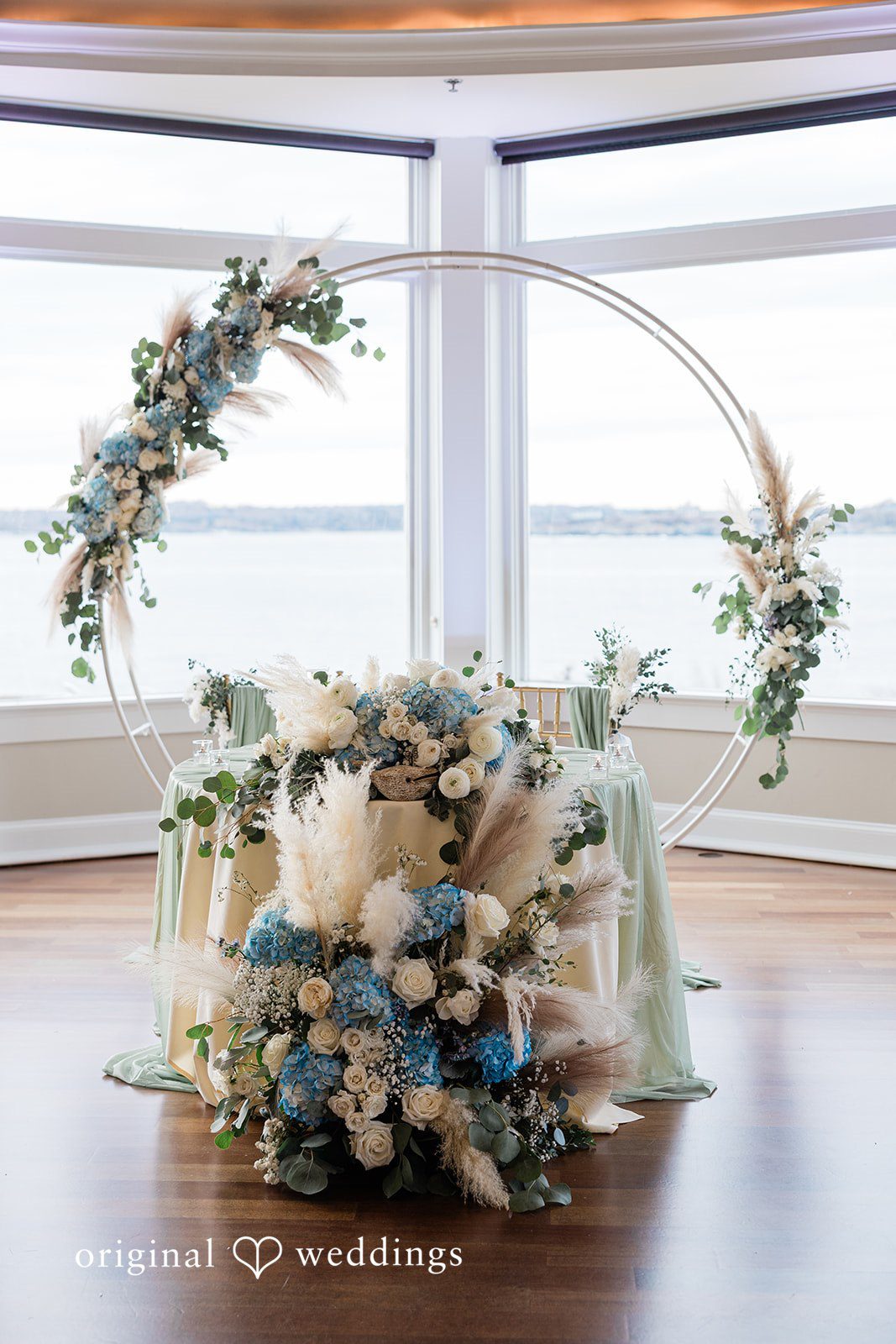Beautifully decorated table with delicate florals at OceanCliff wedding ceremony