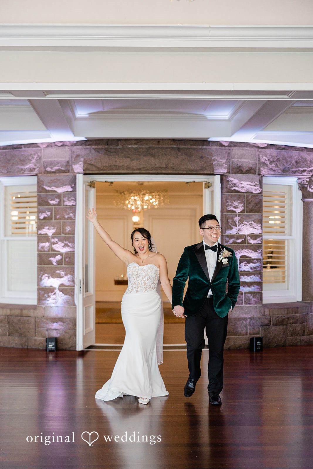 The couple makes a joyful entrance to their wedding reception