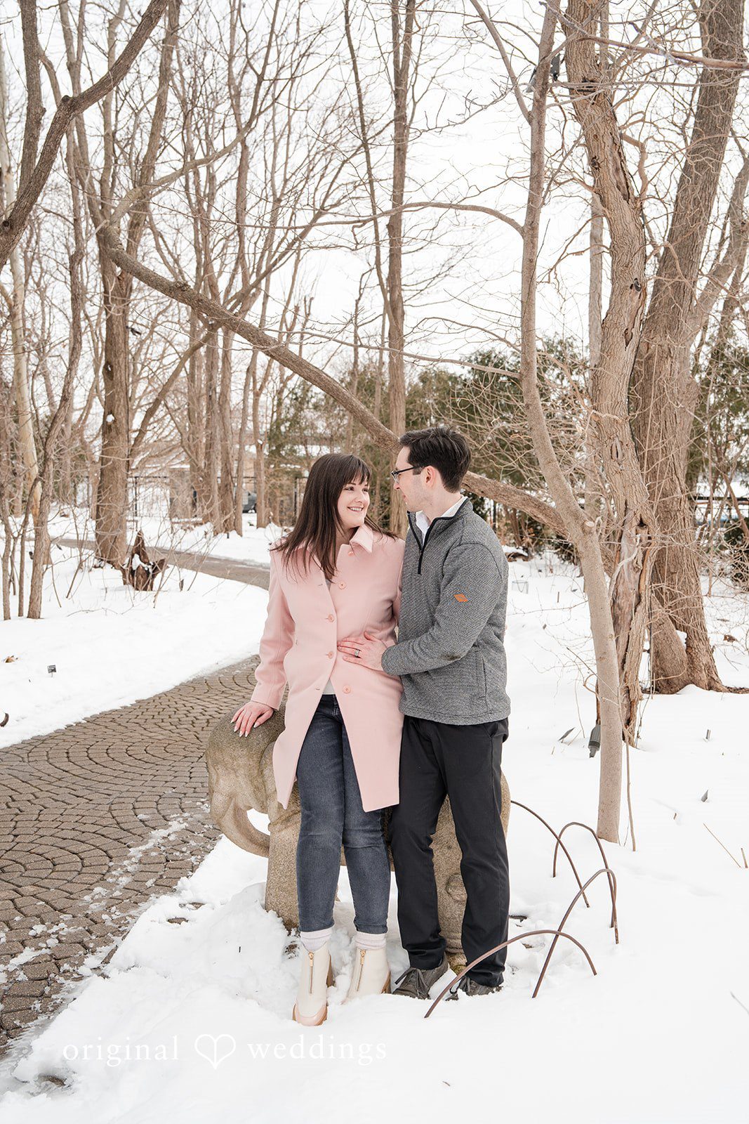 Couple standing close together at Olbrich Gardens