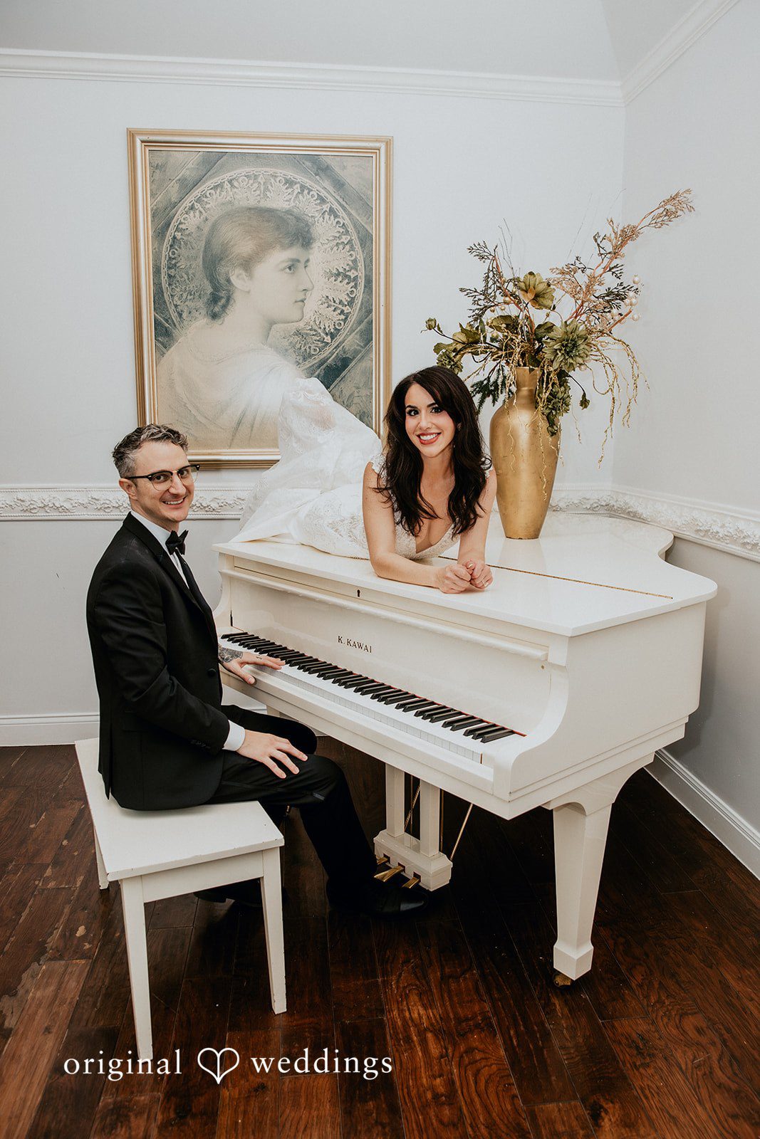 Bride and groom posing at the piano together