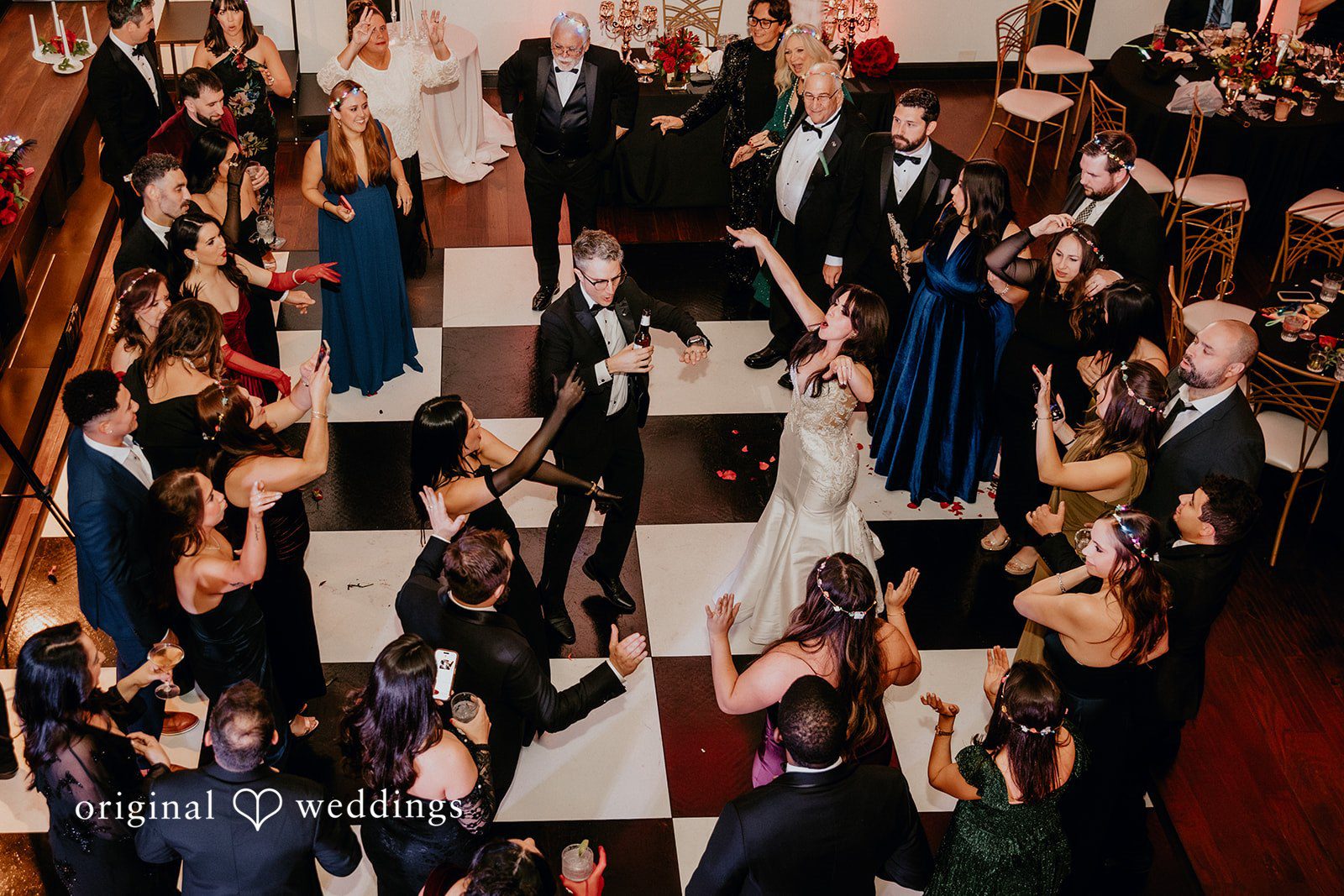 All guests dancing together at the wedding reception