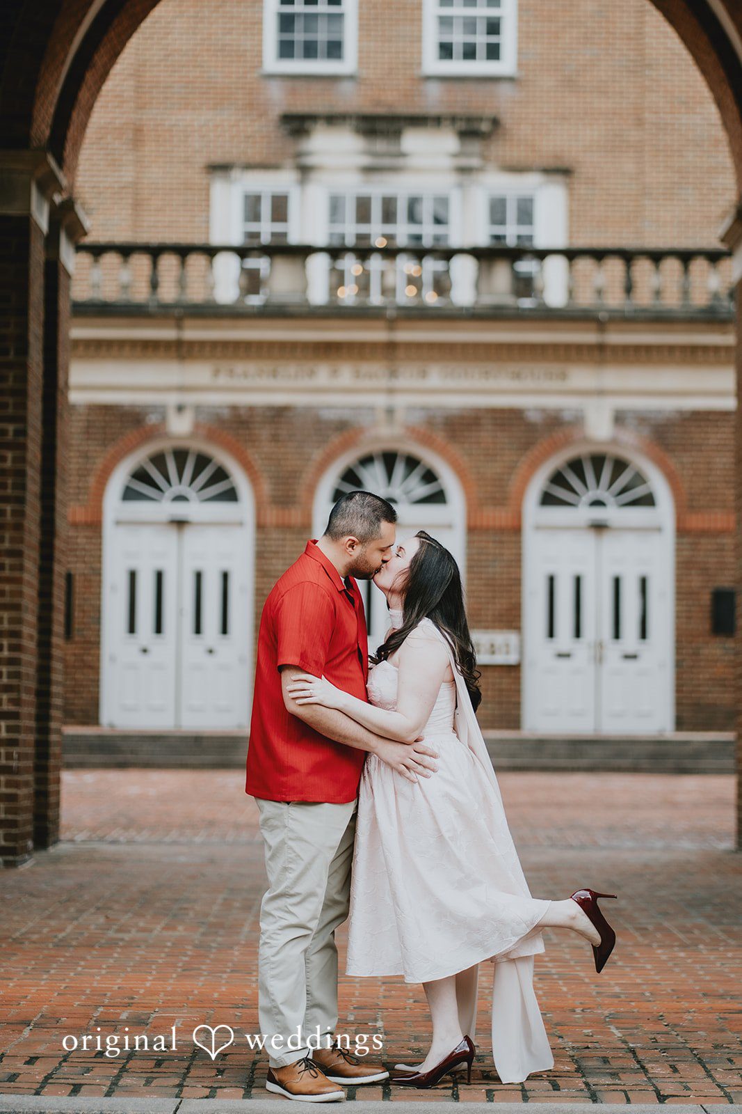 Lucy + Francesco The couple shares a romantic kiss