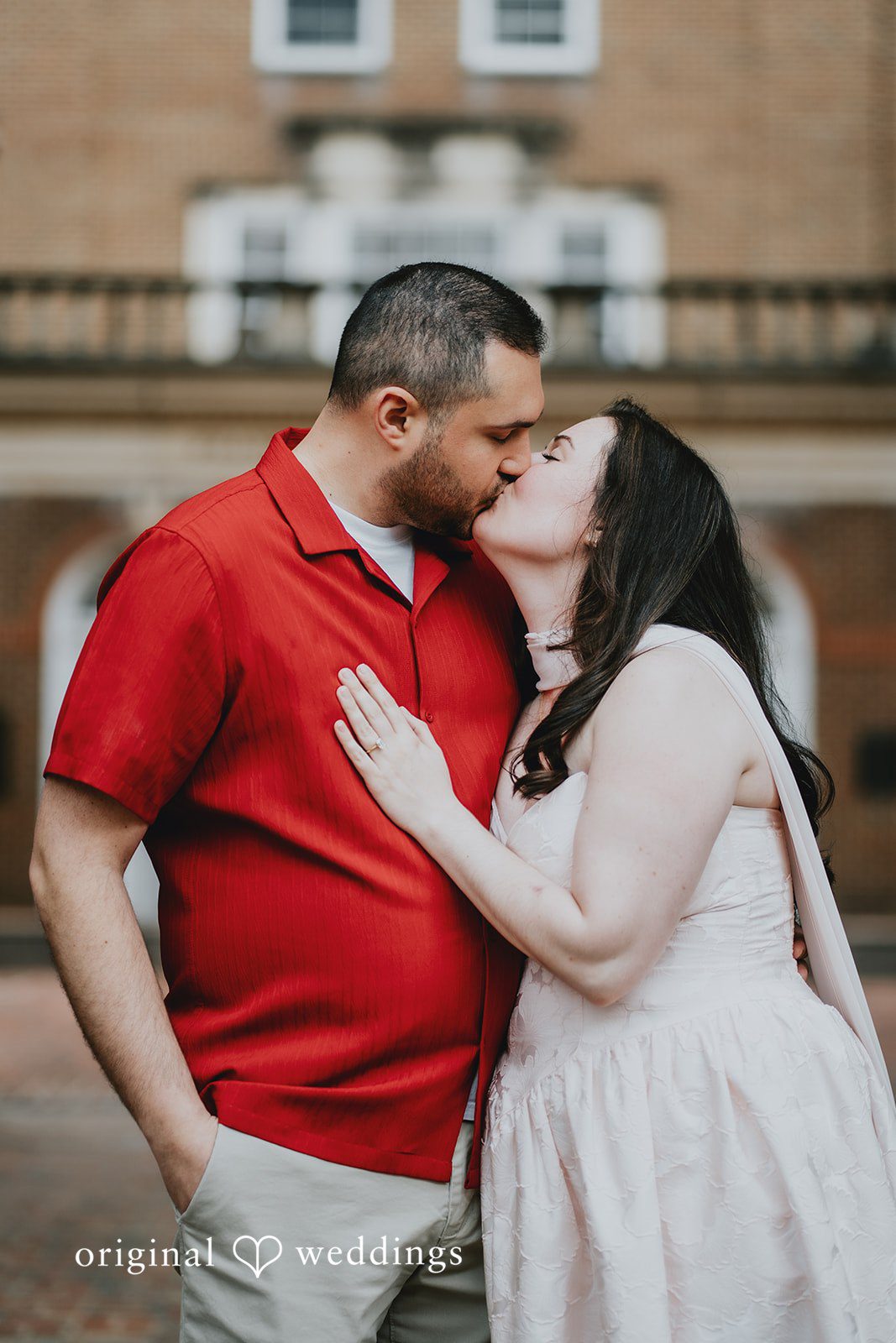 Lucy + Francesco The couple shares a romantic kiss
