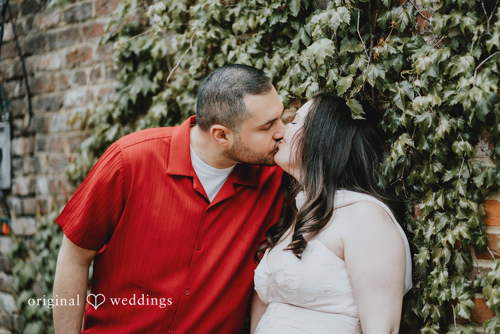 Lucy + Francesco The couple shares a romantic kiss