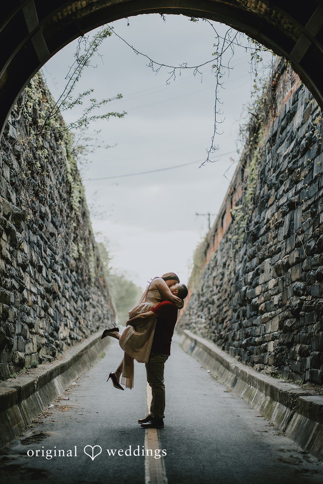 Lucy + Francesco A portrait of the couple by the ivy-covered walls