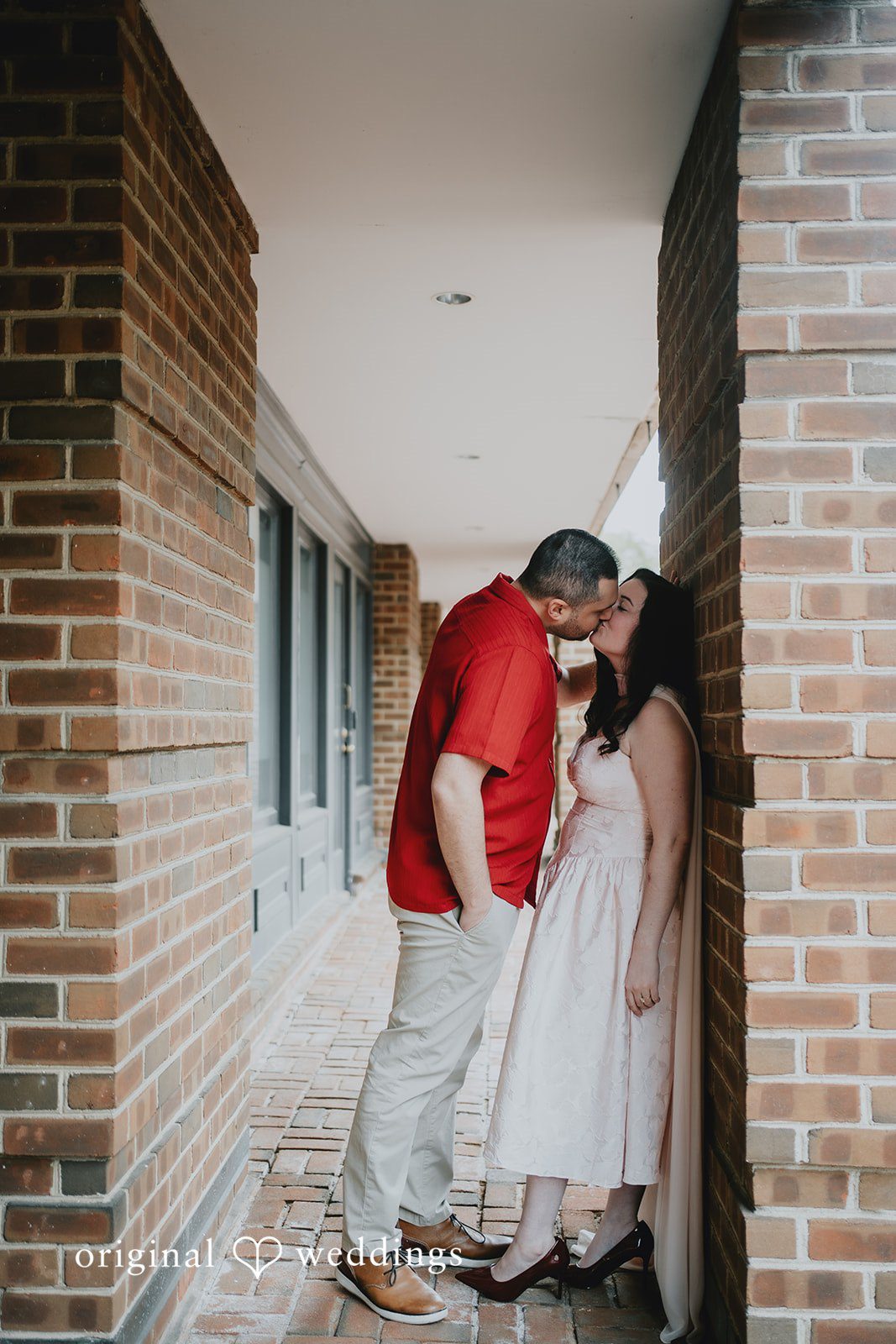 Lucy + Francesco The couple shares a kiss at Old Town Alexandria