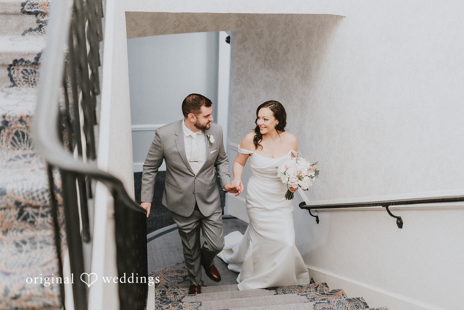 Brooklynn + Adam Boston Wedding Photographers capturing bride and groom walking hand in hand toward the reception at Omni Parker House by Original Weddings