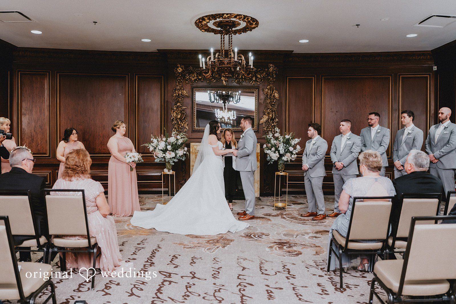 Brooklynn + Adam Boston Wedding Photographers capturing bride and groom holding hands and looking at each other at Omni Parker House by Original Weddings