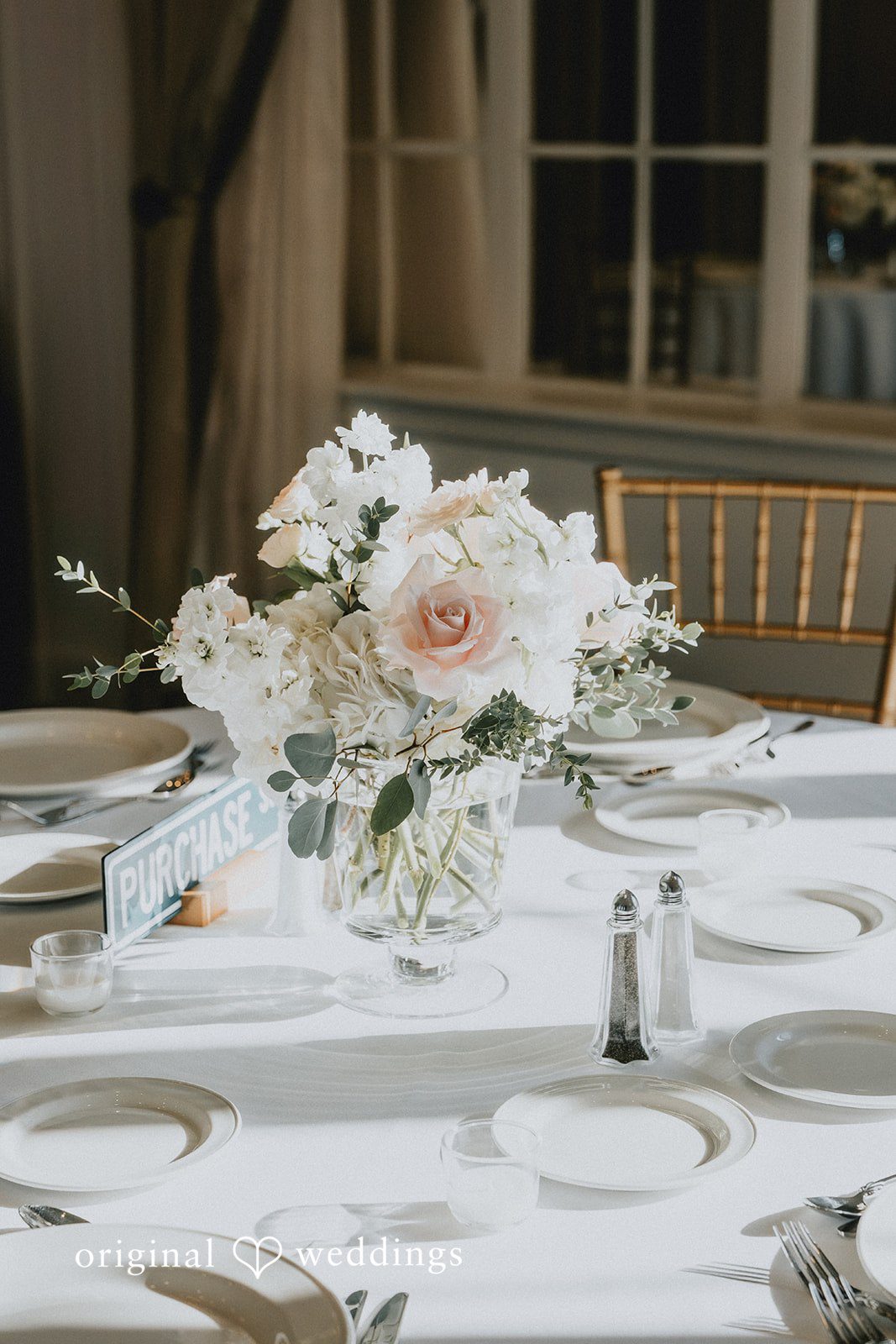 Brooklynn + Adam Artistic dining decor shot with floral and glass elements