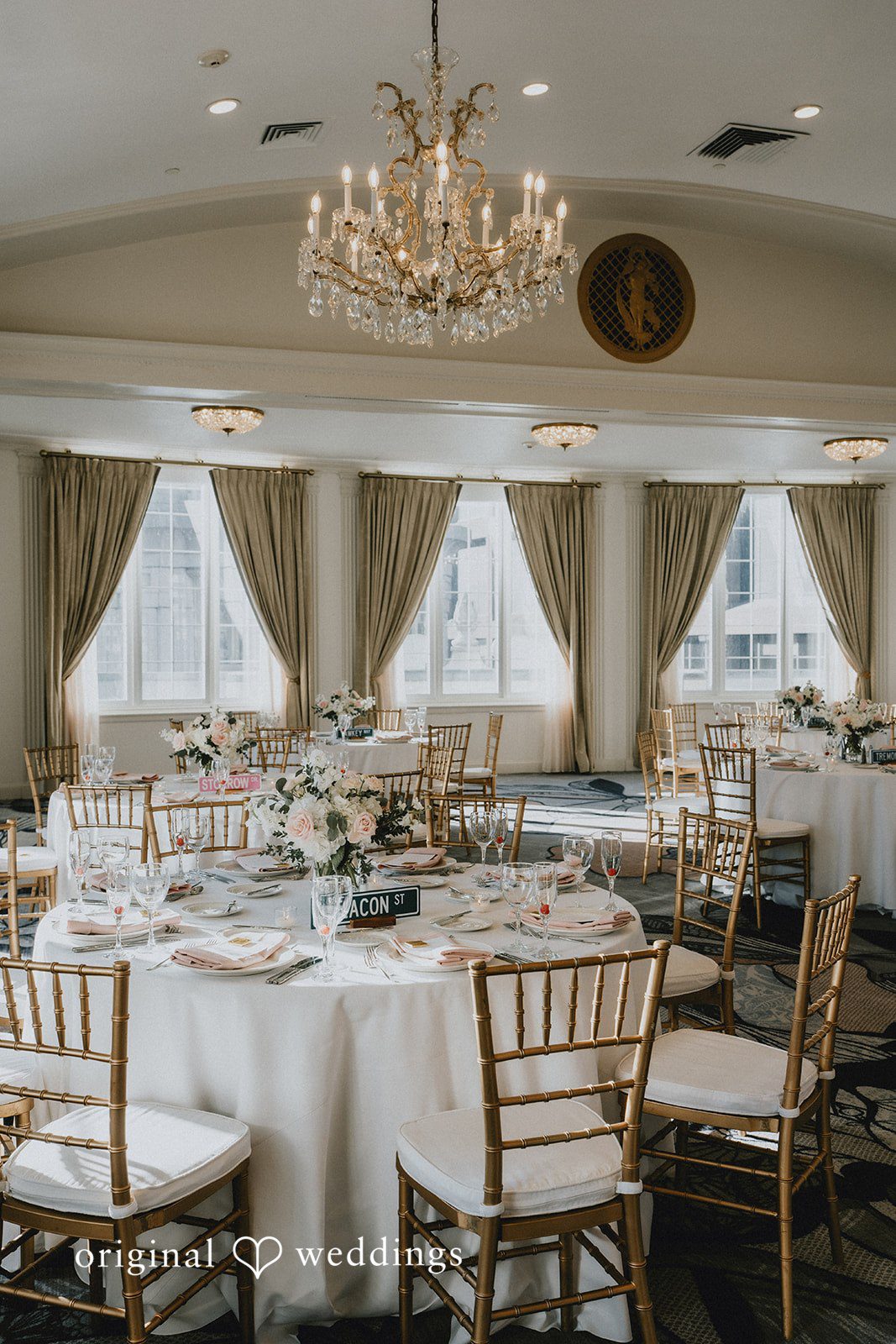 Brooklynn + Adam Close-up reception table decor with flowers and crockery at Omni Parker House