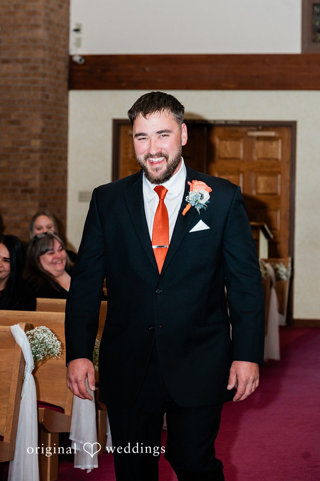 Christina + Quinton The groom happily walks down the aisle