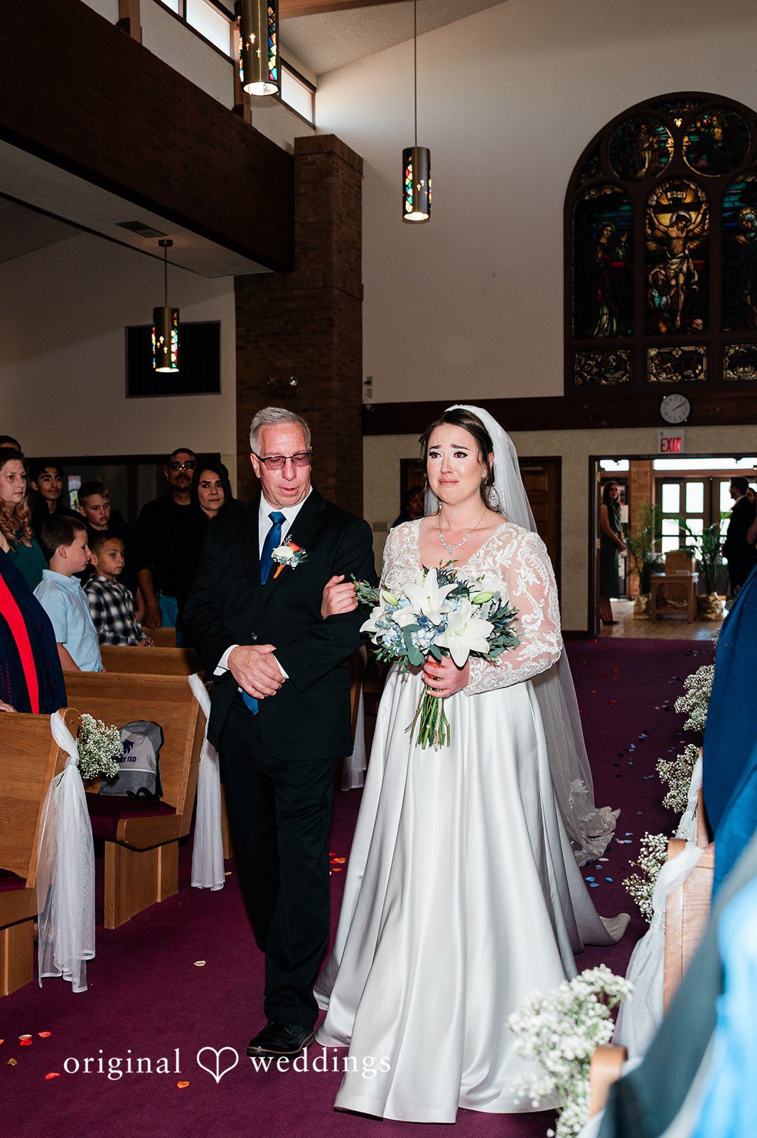 Christina + Quinton The bride's father escorts the bride down the aisle